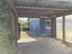 Bild - Wochenendhaus mit Nebengebäude und Carport