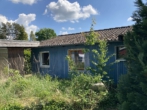 Bild - Wochenendhaus mit Nebengebäude und Carport